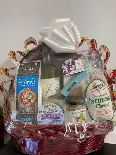 Pizza-themed basket with cheese, wine