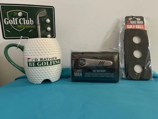 Golf-themed mug, golf ball, accessories