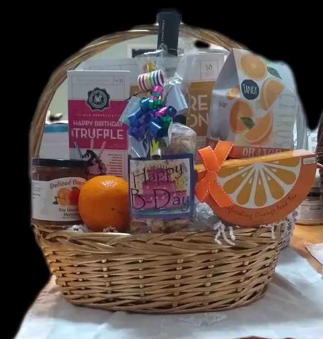 Orange Birthday Basket Bottle of Wine, Birthday Chocolate bar, Orange Iced Tea, Orange Cookies, Fresh Oranges, Birthday Trail Mix, Dip, Crackers